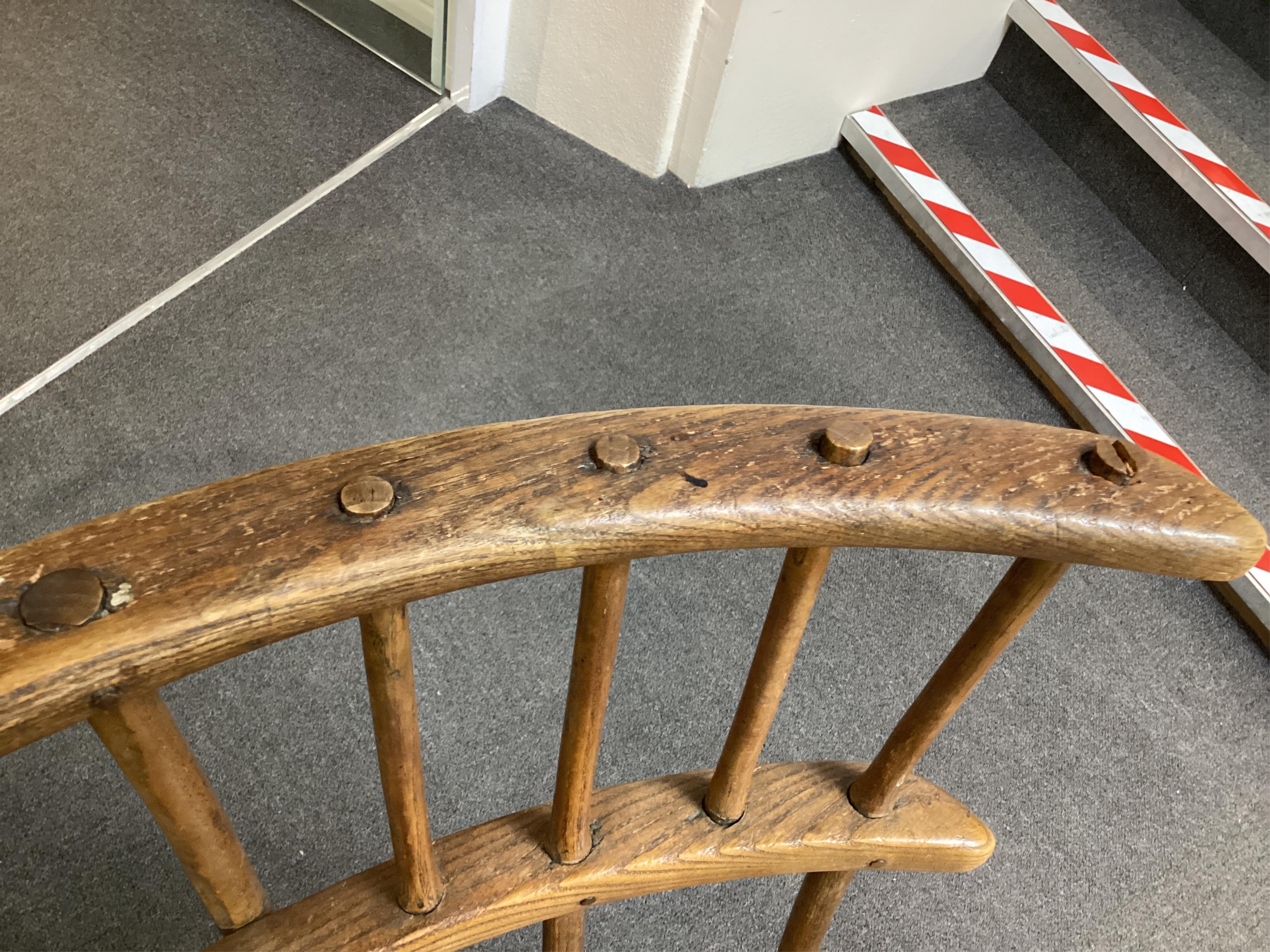 An 18th or 19th century primitive ash and elm Windsor armchair